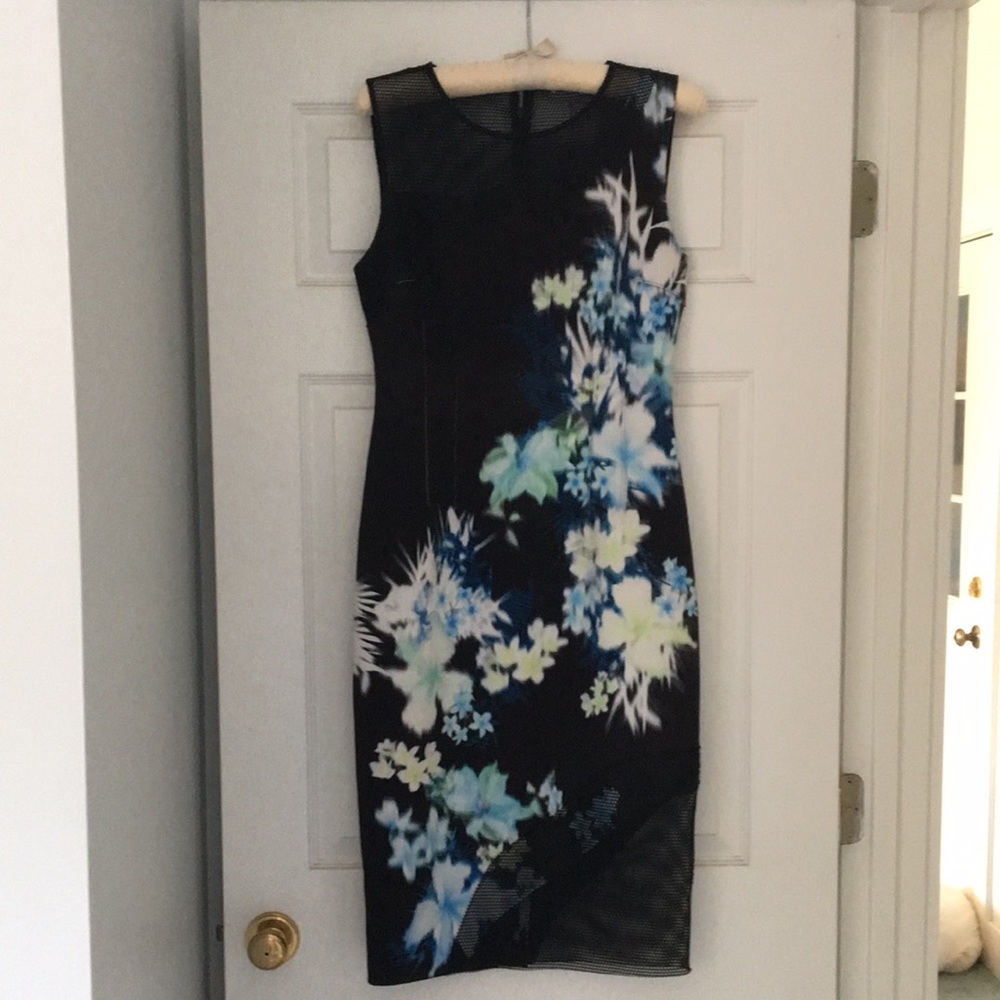 Very cool print dress with mesh inserts, size 6.
